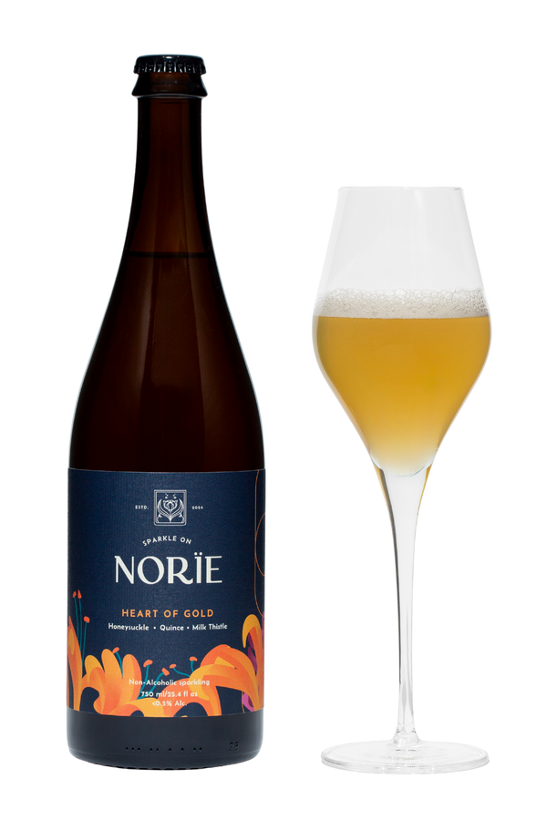 Norïe Heart of Gold non-alcoholic sparkling botanical drink bottle with glass